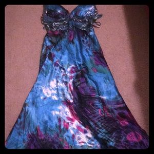 This is a turquoise purple pink whit green dress